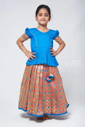 Charming Blue Silk Peplum Blouse with Zari Floral Pattu Pavadai: Perfect Celebration Wear for Girls