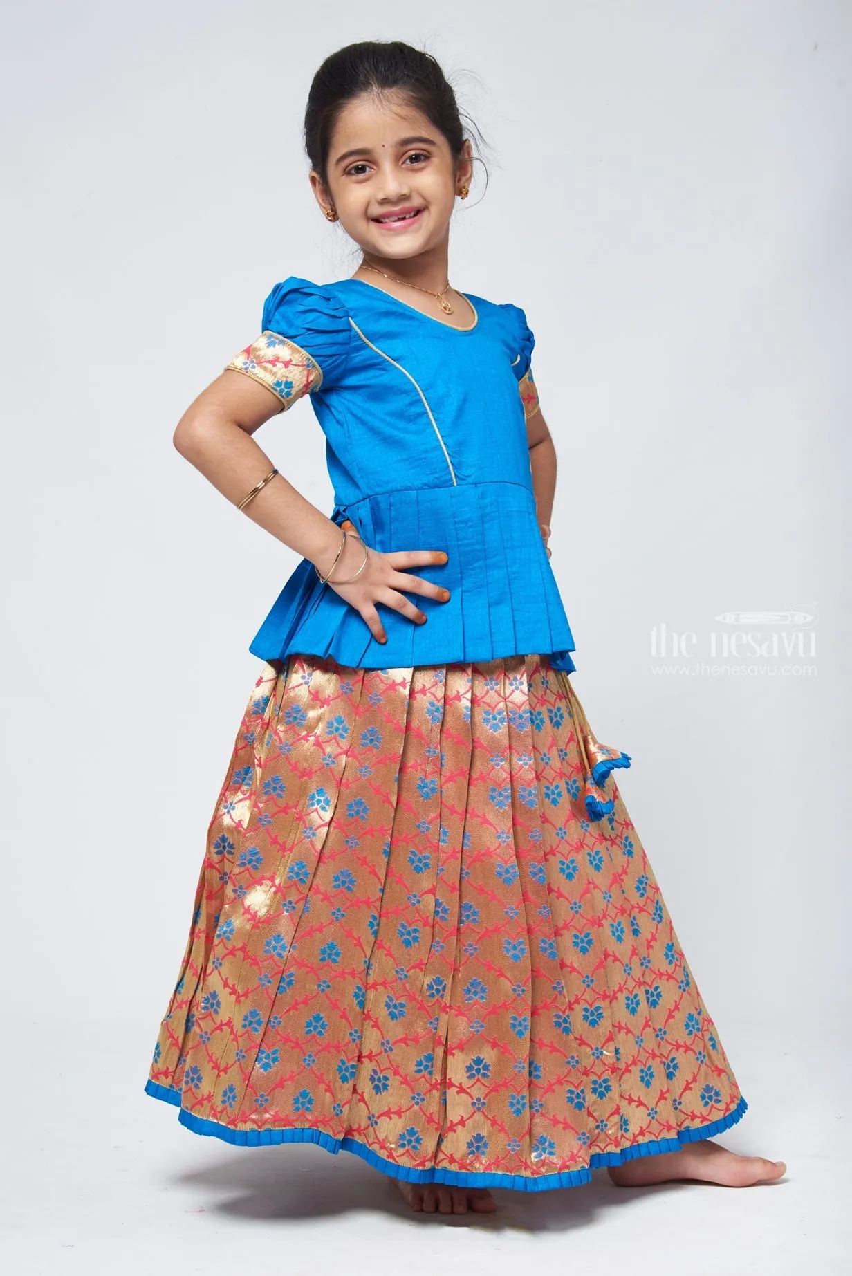 Charming Blue Silk Peplum Blouse with Zari Floral Pattu Pavadai: Perfect Celebration Wear for Girls